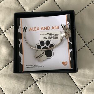 New in box Alex and Ani bracelets with paw and  Saworski crystals.